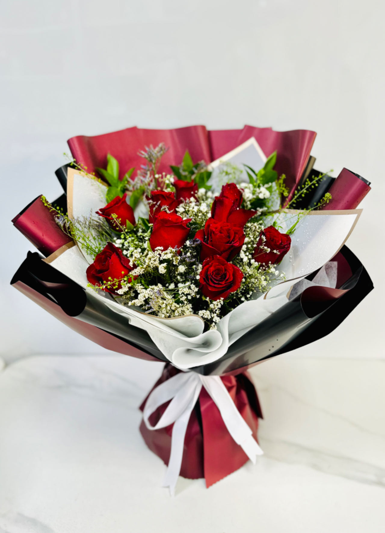 Red Roses in White and Red Bouquet